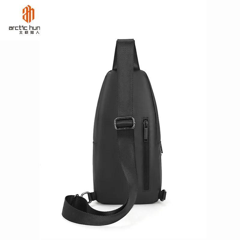 Water-Resistant Arctic Hunter Sling Bag with Built-in Earphone Jack for Men and Women - Durable Shoulder Daypack with Shock-Proof Compartments XB13001_Black